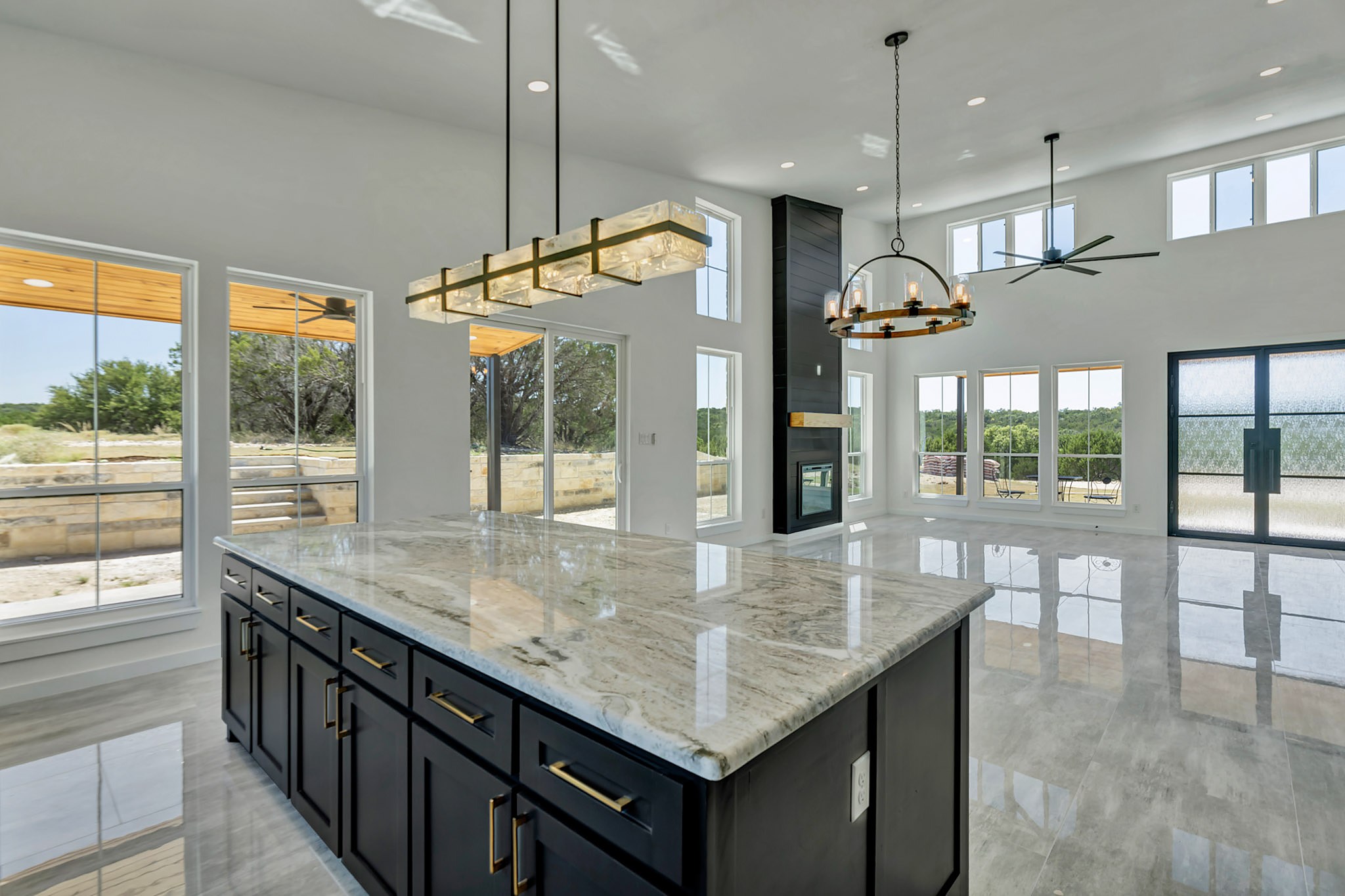 Open great room and kitchen with a vaulted ceiling and no center posts